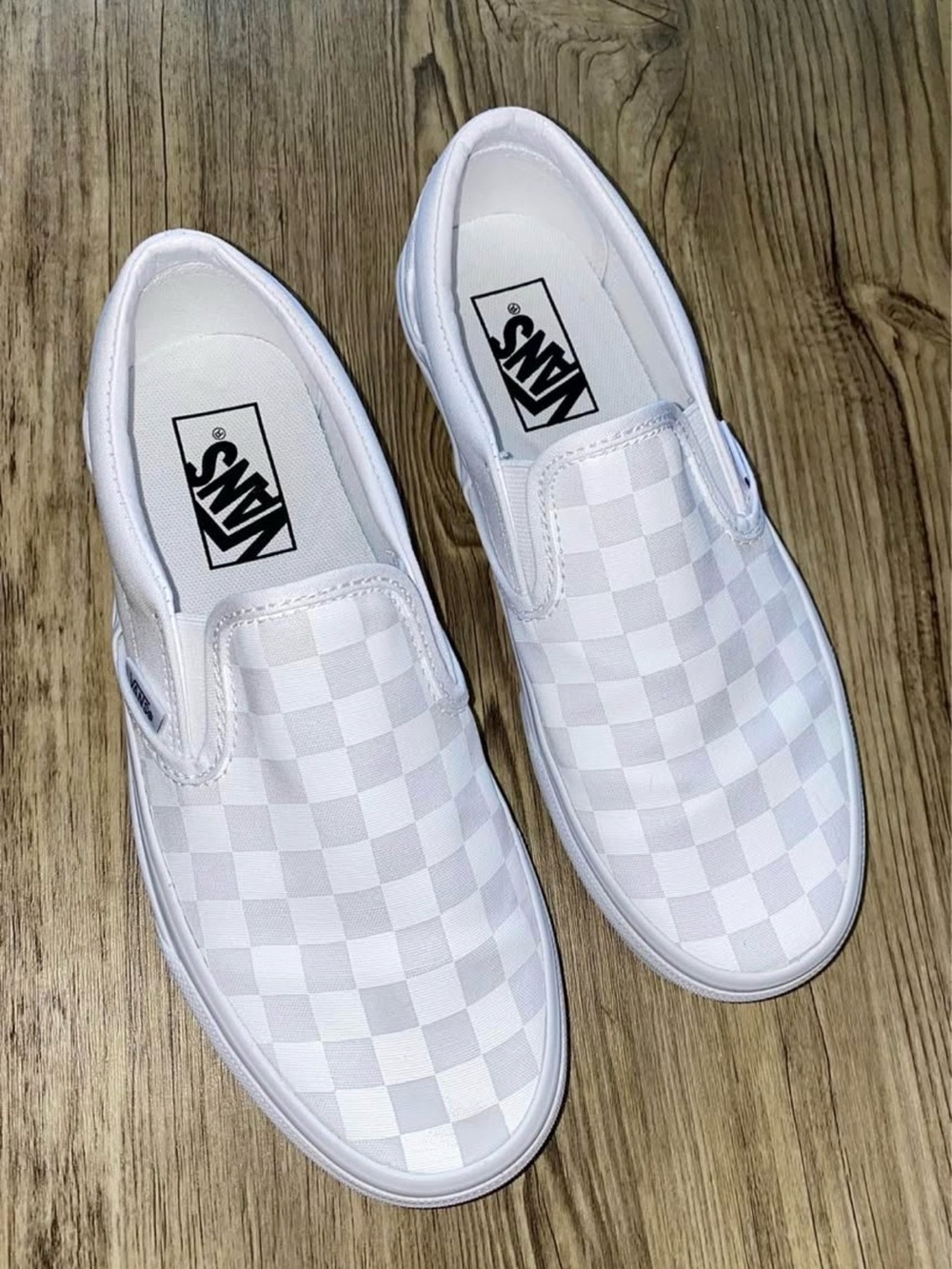 Vans White Checkerboard Slip-Ons